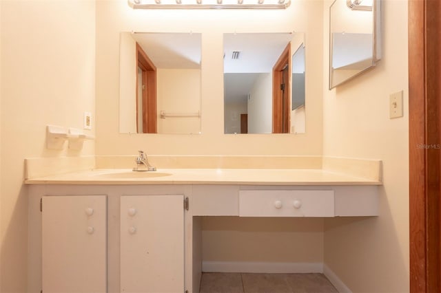 bathroom with vanity and tile patterned flooring