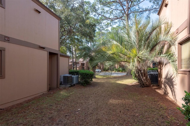 view of yard with central air condition unit