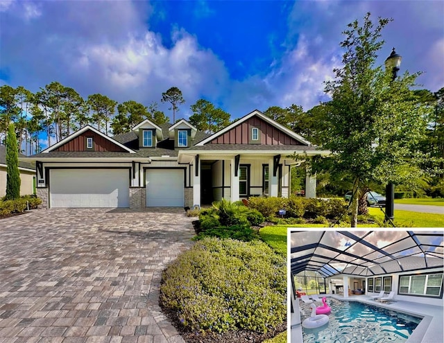 craftsman-style home featuring a garage and glass enclosure