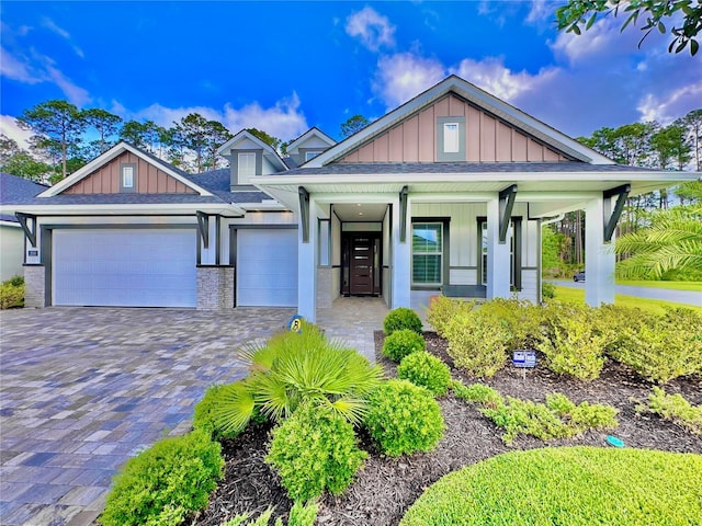 view of front of home with a garage and covered porch