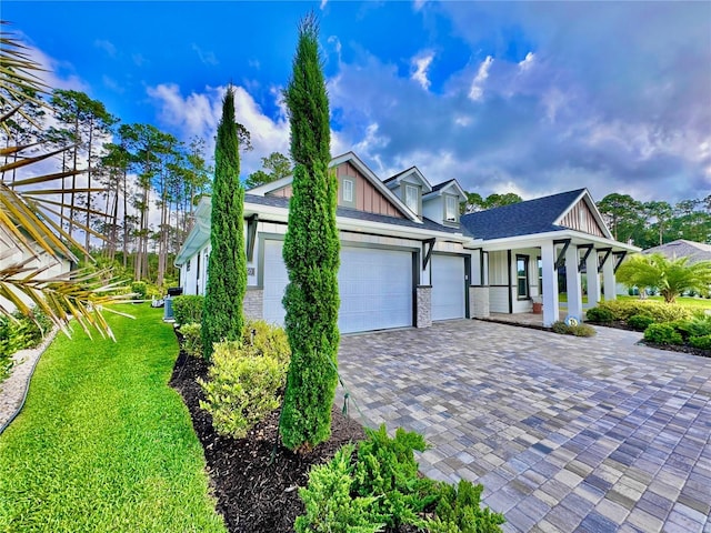 view of front of property featuring a garage and a front yard