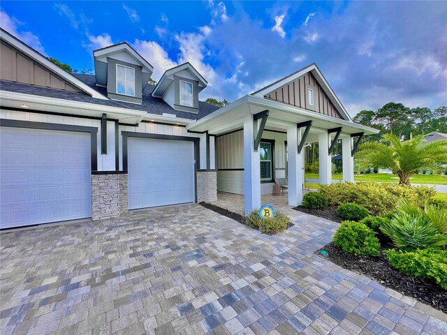 view of front of home with a garage and covered porch