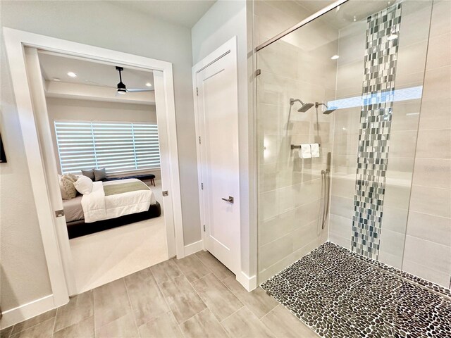 bathroom featuring walk in shower and ceiling fan