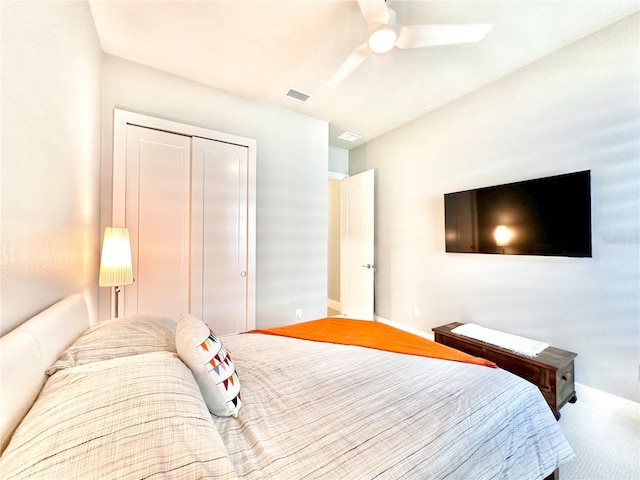 bedroom with carpet flooring, ceiling fan, and a closet