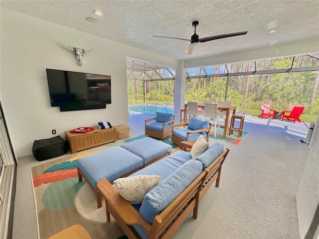 view of patio with an outdoor living space and glass enclosure