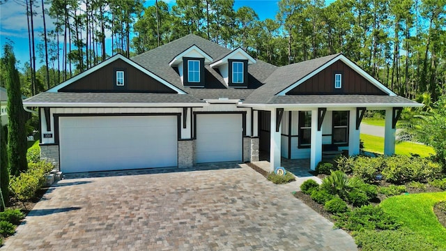 craftsman house featuring a garage and a porch