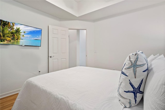 bedroom featuring wood-type flooring