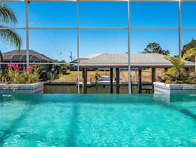 view of swimming pool with a water view