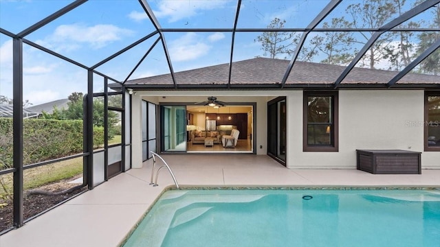 rear view of house featuring ceiling fan, a lanai, and a patio