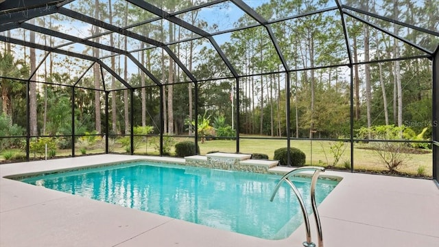 view of pool featuring a patio, glass enclosure, and a lawn