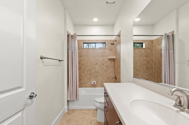 full bathroom featuring vanity, shower / tub combo with curtain, tile patterned floors, and toilet