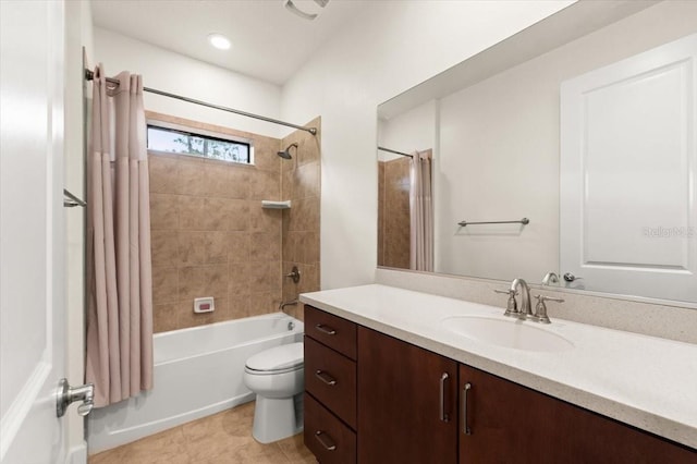 full bathroom with vanity, shower / tub combo with curtain, and toilet