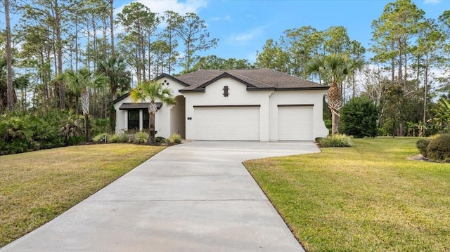 view of front of property with a garage and a front lawn