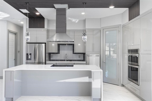 kitchen with pendant lighting, white cabinetry, stainless steel appliances, and sink