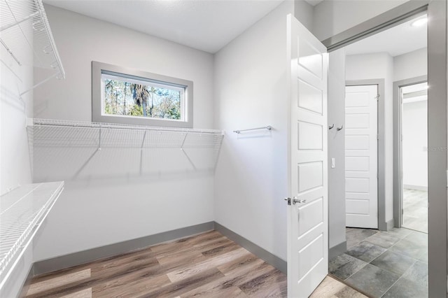 walk in closet featuring hardwood / wood-style floors