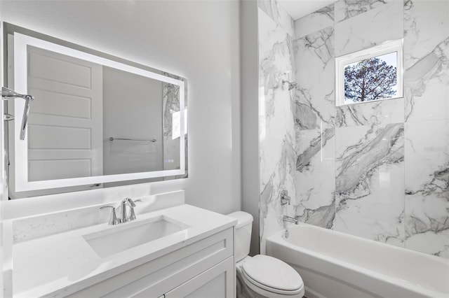 full bathroom with tiled shower / bath combo, vanity, and toilet