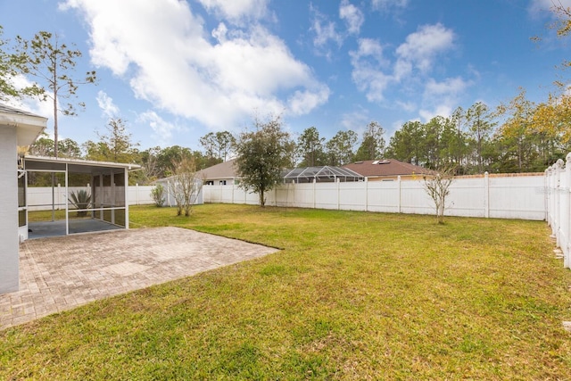 view of yard with a patio area and a sunroom