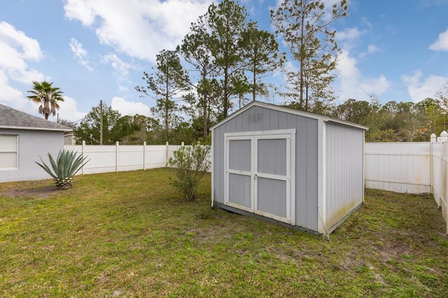 view of outbuilding with a yard