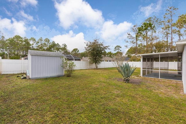 view of yard with a sunroom and a shed