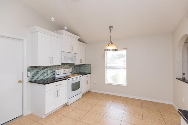 kitchen featuring white cabinetry, backsplash, white appliances, and light tile patterned floors