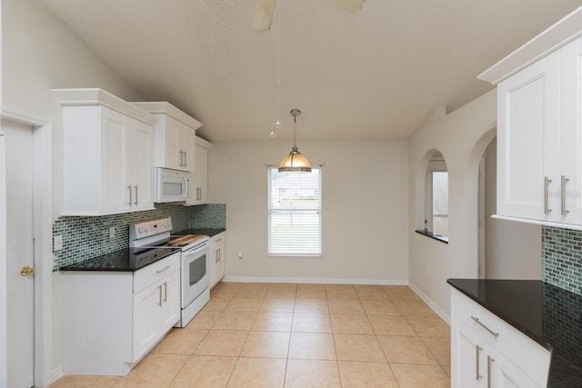 kitchen featuring backsplash, white appliances, and white cabinets