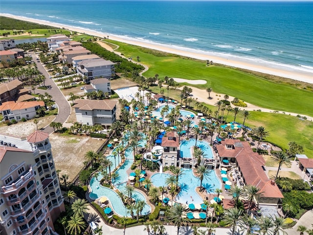 bird's eye view featuring a water view and a view of the beach