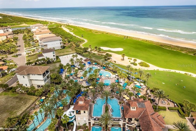 drone / aerial view with a water view and a beach view