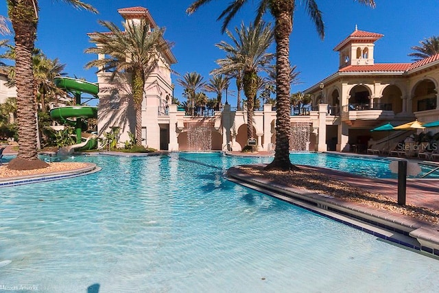 view of pool with a water slide