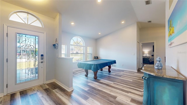 game room featuring light hardwood / wood-style flooring, vaulted ceiling, and billiards