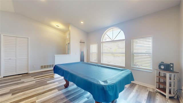 playroom featuring pool table, vaulted ceiling, and light hardwood / wood-style flooring