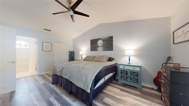 bedroom with lofted ceiling, hardwood / wood-style floors, and ceiling fan