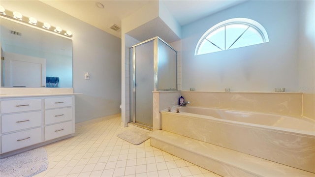 bathroom with tile patterned floors, vanity, and shower with separate bathtub