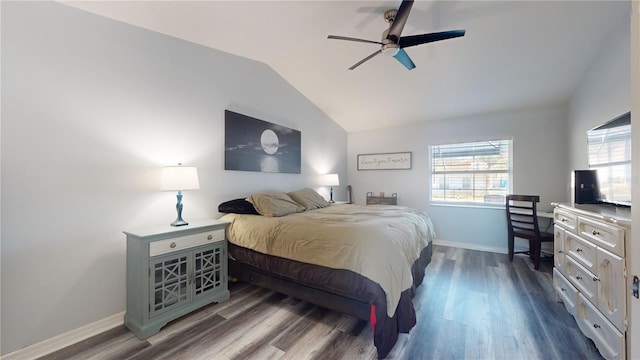 bedroom with dark wood-type flooring, ceiling fan, and vaulted ceiling