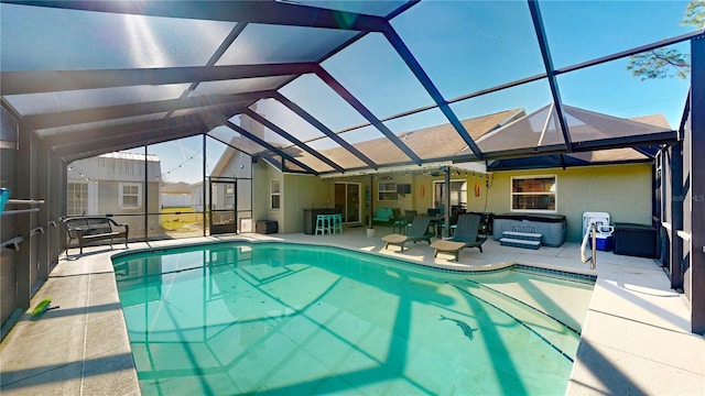 view of swimming pool featuring a patio area and glass enclosure