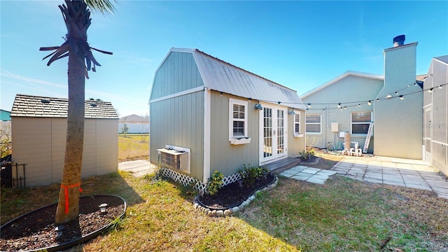 exterior space featuring a storage shed and a yard