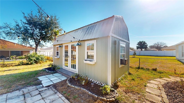 view of outbuilding with a lawn