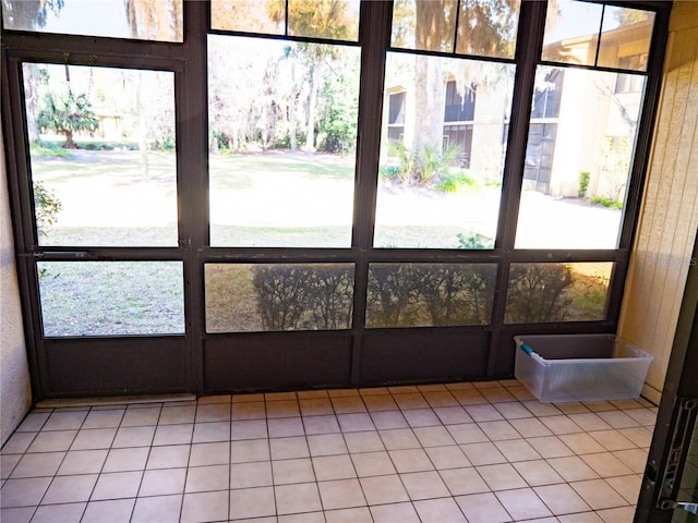 unfurnished sunroom with a healthy amount of sunlight