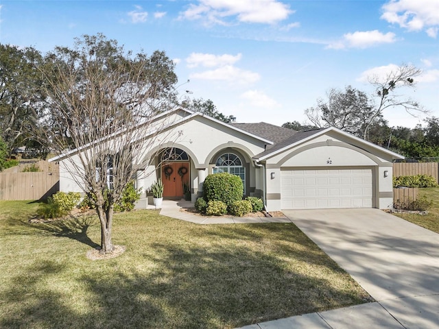 ranch-style house featuring a garage and a front lawn