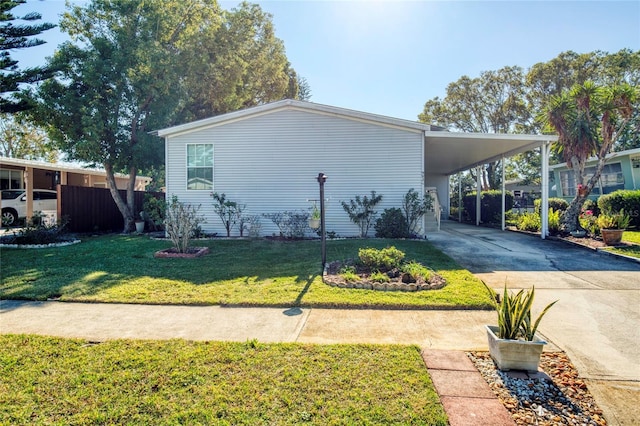 view of property exterior featuring a lawn and a carport