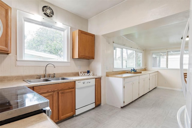 kitchen featuring stainless steel electric range oven, white dishwasher, and sink