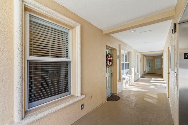 hall featuring concrete floors