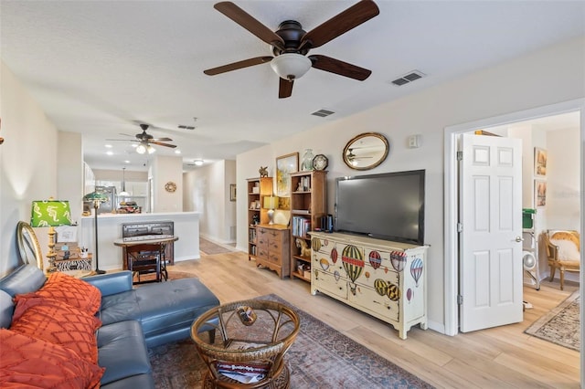 living room with light hardwood / wood-style floors