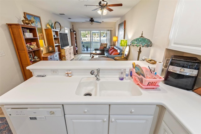 interior space featuring white cabinetry, sink, kitchen peninsula, and dishwasher