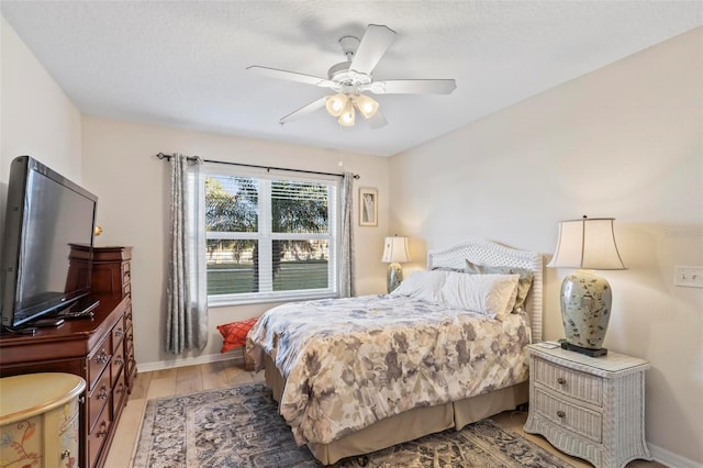 bedroom featuring ceiling fan and light wood-type flooring