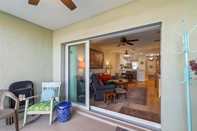 view of patio featuring ceiling fan