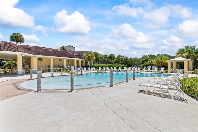 view of swimming pool with a gazebo and a patio