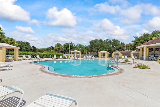 view of swimming pool featuring a gazebo and a patio