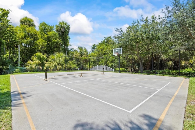 view of tennis court featuring basketball court