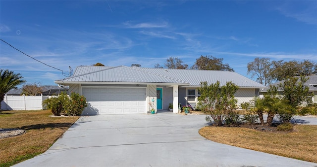 ranch-style home featuring a garage and a front lawn