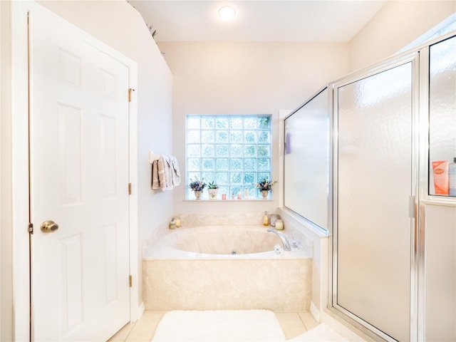 bathroom with tile patterned flooring and plus walk in shower